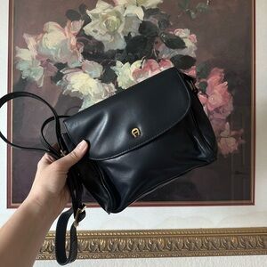 Vintage 80's Etienne Aigner black leather crossbody bag with brass hardware